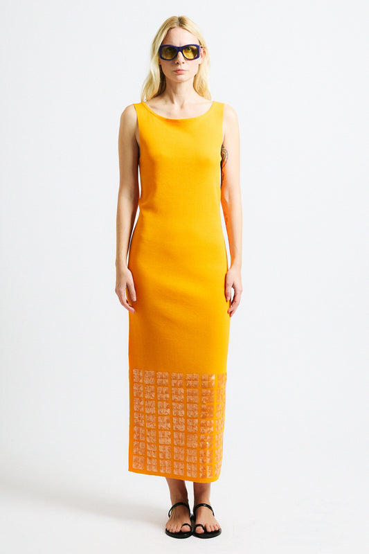 Link to "Tosca" dress. Image is of a female model wearing backless crewneck bright orange dress with layered sequin hem.